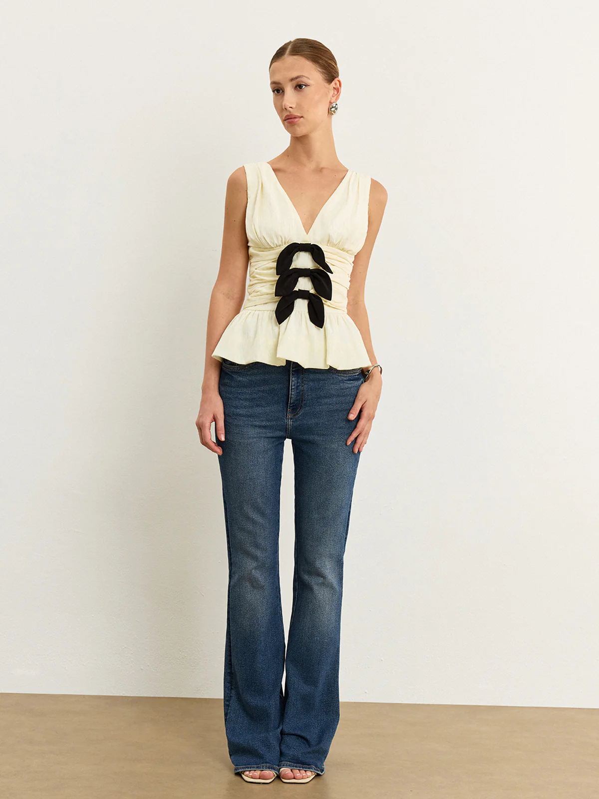 Bow-Detail Ruched Top with Peplum Hem - Wholesalesil
