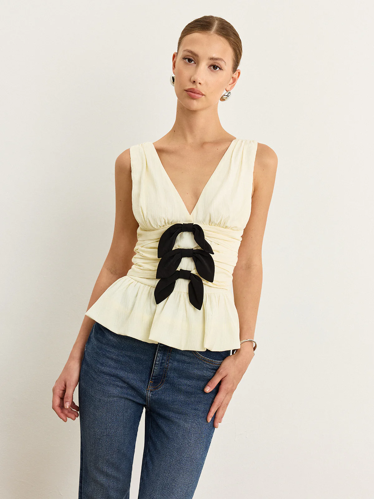 Bow-Detail Ruched Top with Peplum Hem - Wholesalesil